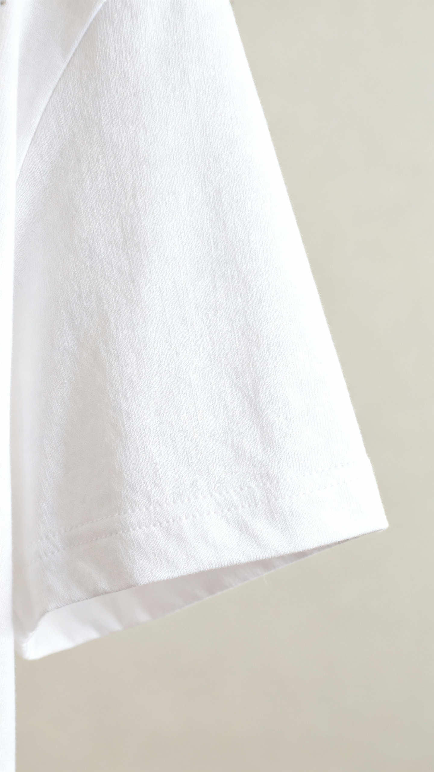 Closeup of white structured tee fabric, 200 GSM, boxy hem