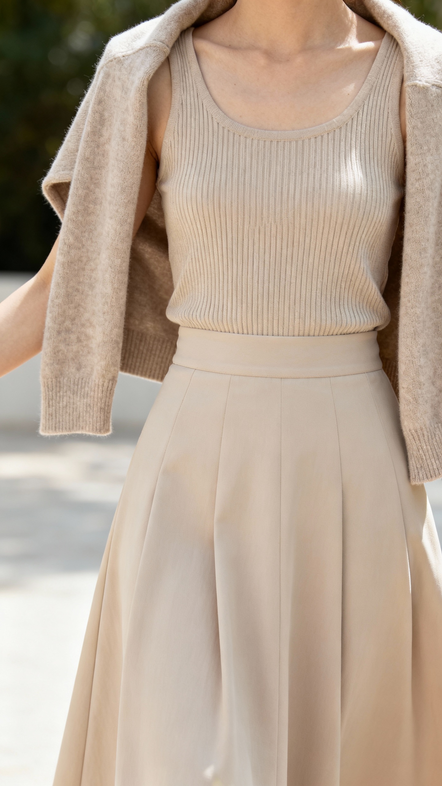 Ribbed tank with A-line midi, cropped cardigan draped, soft daylight
